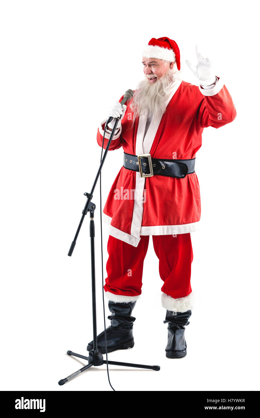 Le père noël chante des chansons de Noël Banque D'Images