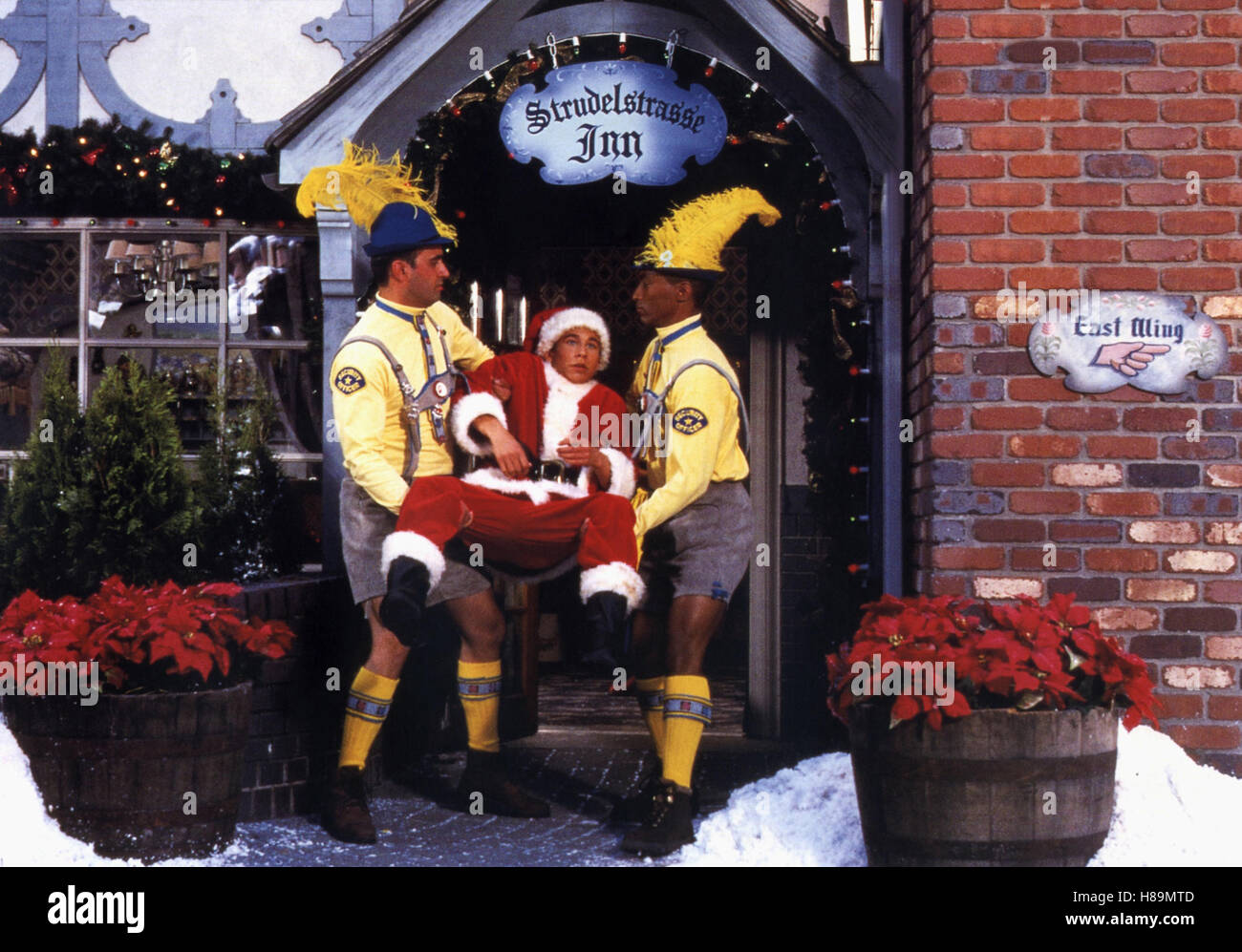 Eine Bescherung ancien wüste, (C'ÉTAIT PAS) USA 1998, Regie : Arlene Sanford, JONATHAN TAYLOR THOMAS, Ausdruck : Weihnachtsmann, Nikolaus, Türsteher, Rauswurf, Lederhosen, Wadlstrümpfe, Weihnachtsstern Banque D'Images