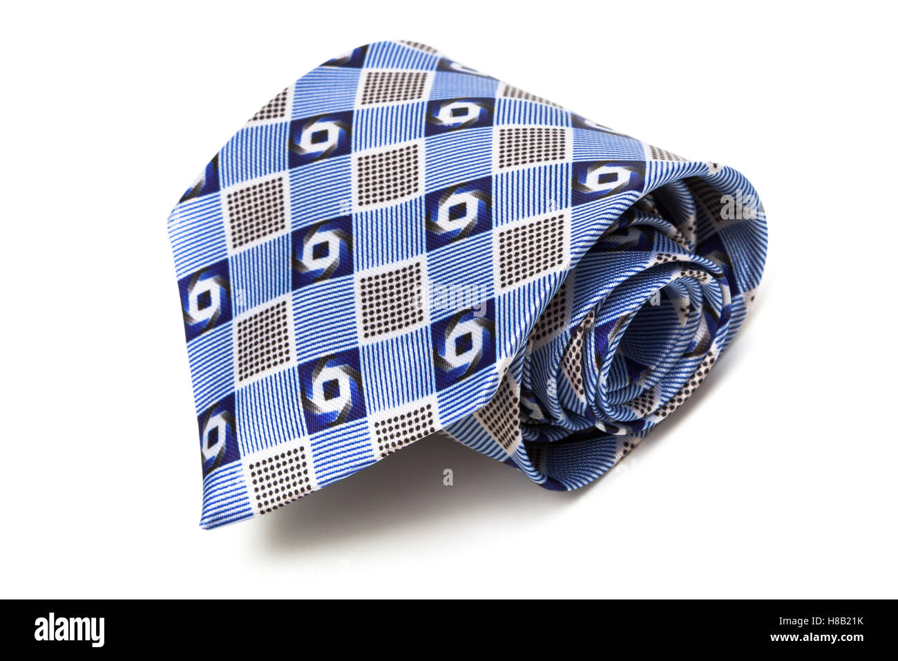 Cravate bleue enroulé sur un fond blanc Photo Stock - Alamy