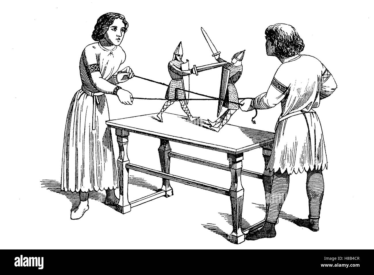 Des garçons Costume 12. siècle, la lecture de la marionnette, l'histoire de la mode, des costumes story Banque D'Images