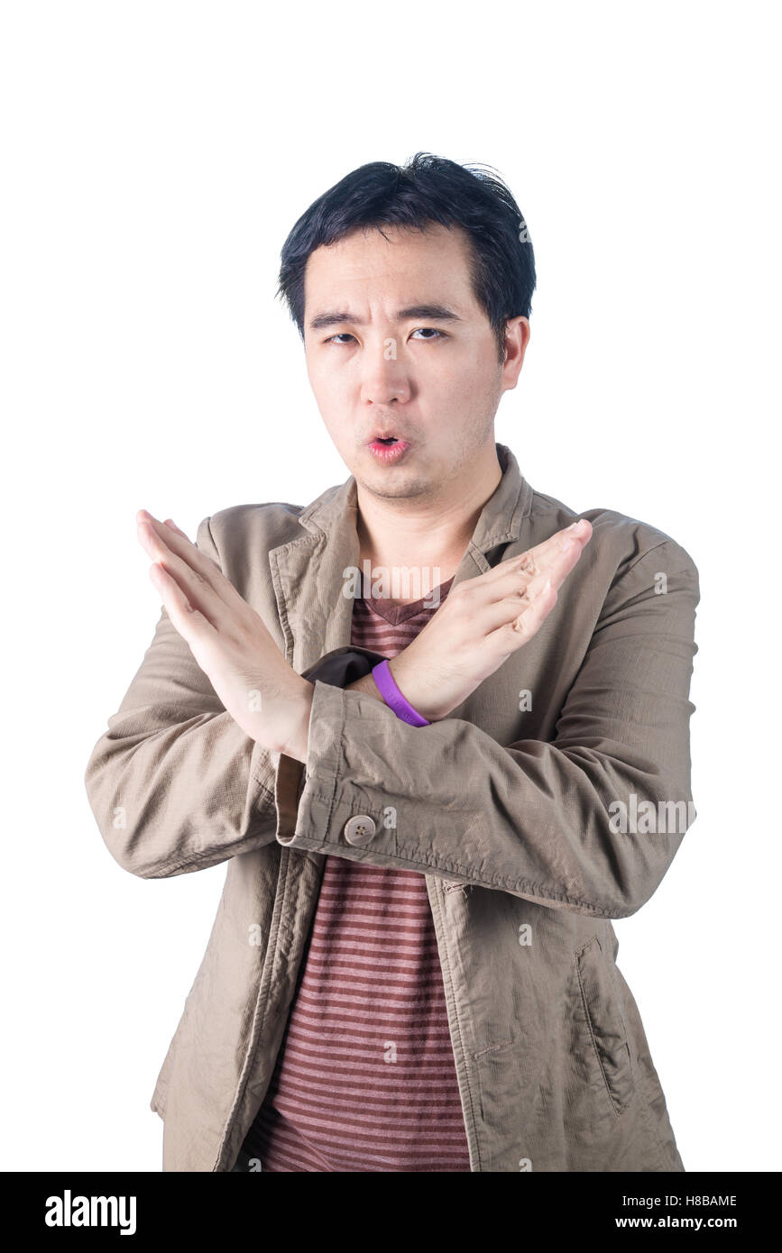 Jeune homme asiatique pompée, faisant signe X forme avec ses bras et ses mains, ses bras et mains, dire non, isolé sur blanc retour Banque D'Images