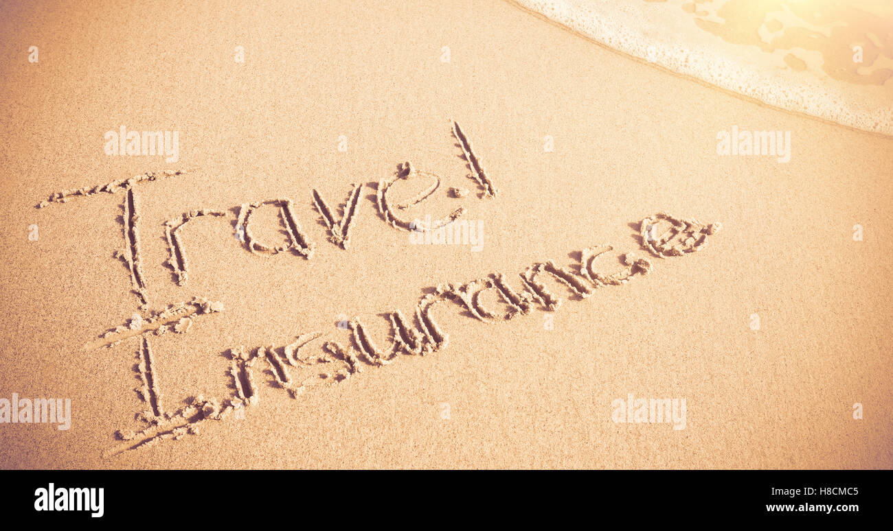 Assurance voyage written on sand Banque D'Images