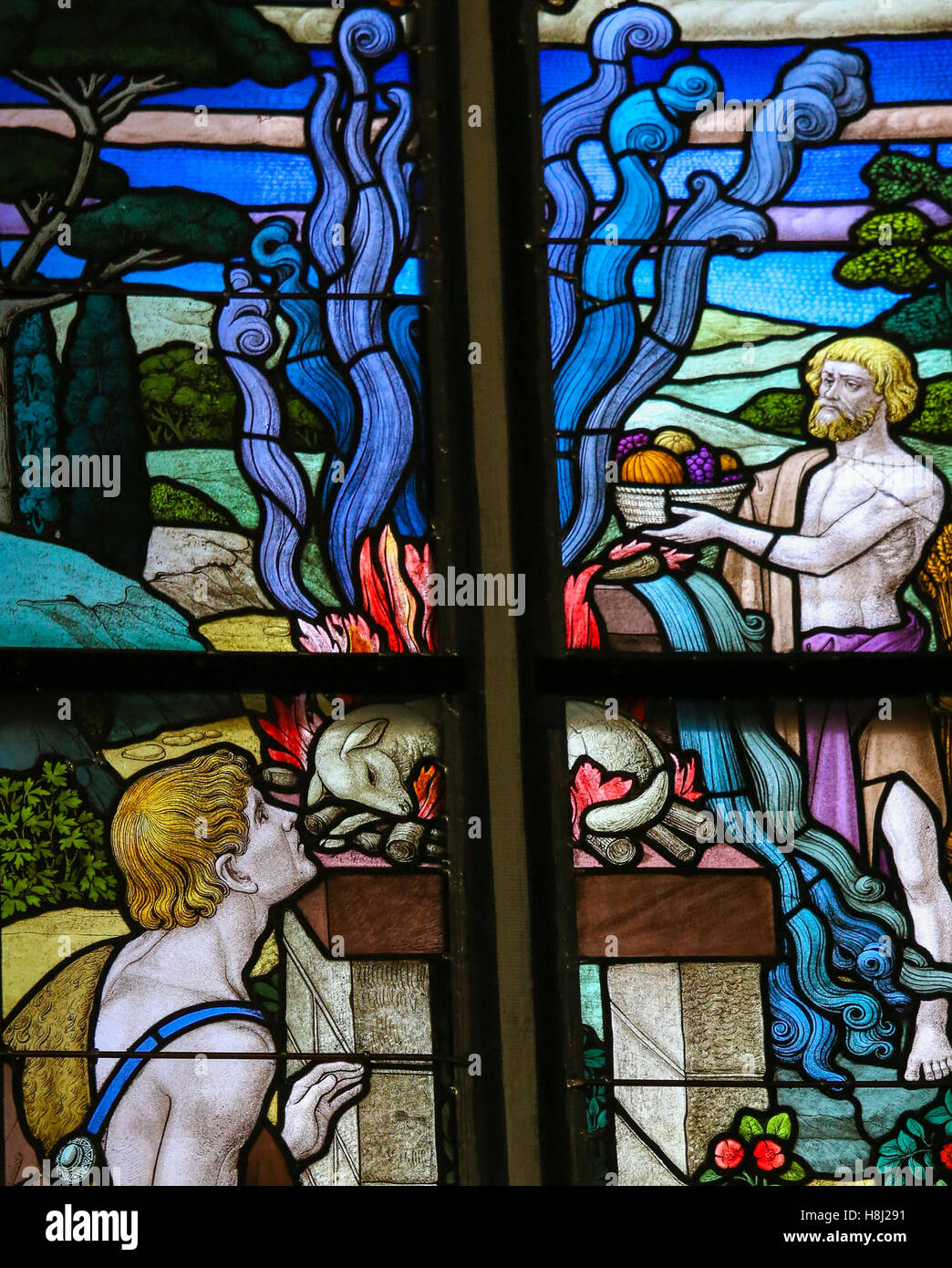 Vitrail représentant un sacrifice d'agneaux dans la Cathédrale de St Rumbold de Mechelen, Belgique. Banque D'Images