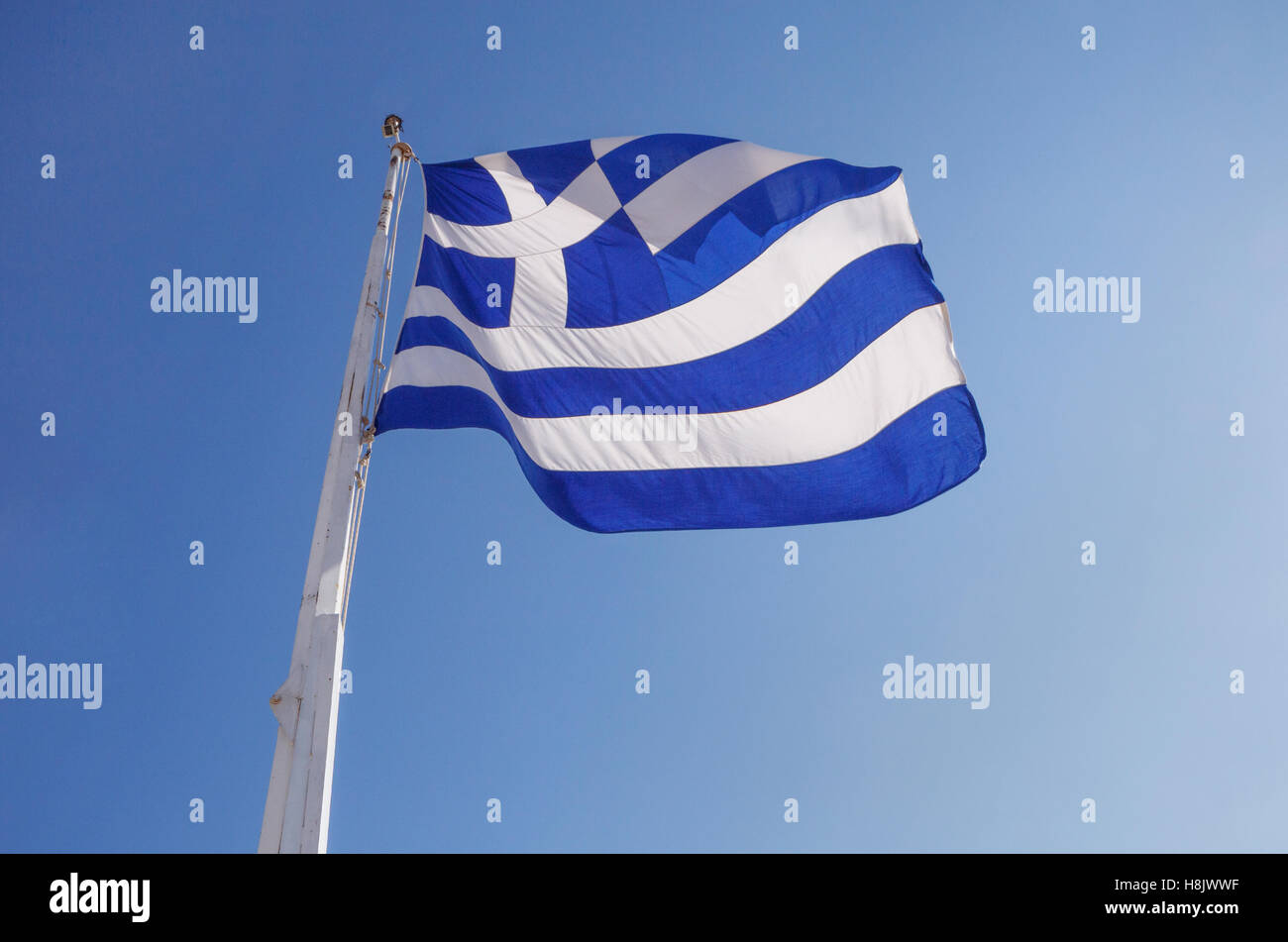 Drapeau de la Grèce sur l'acropole d'Athènes Banque D'Images