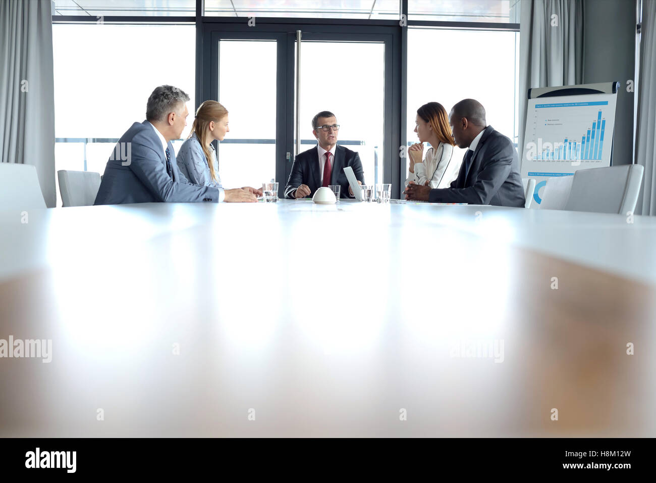 Multi-ethnic business people at conference table Banque D'Images