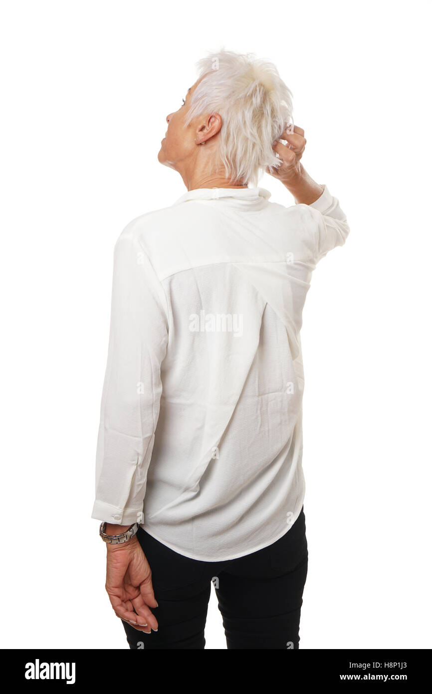 Femme plus âgée se gratter la tête Banque D'Images