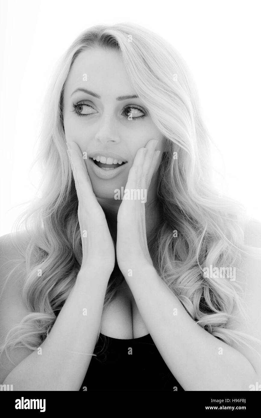 Portrait d'une fille à choqué et surpris sur un fond blanc. Banque D'Images