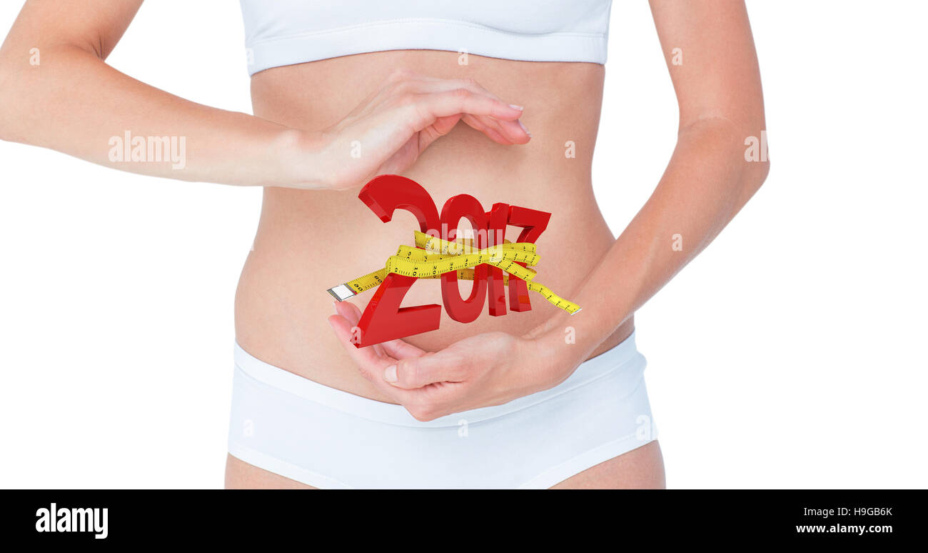 Image composite de femme avec les mains sur le ventre Banque D'Images