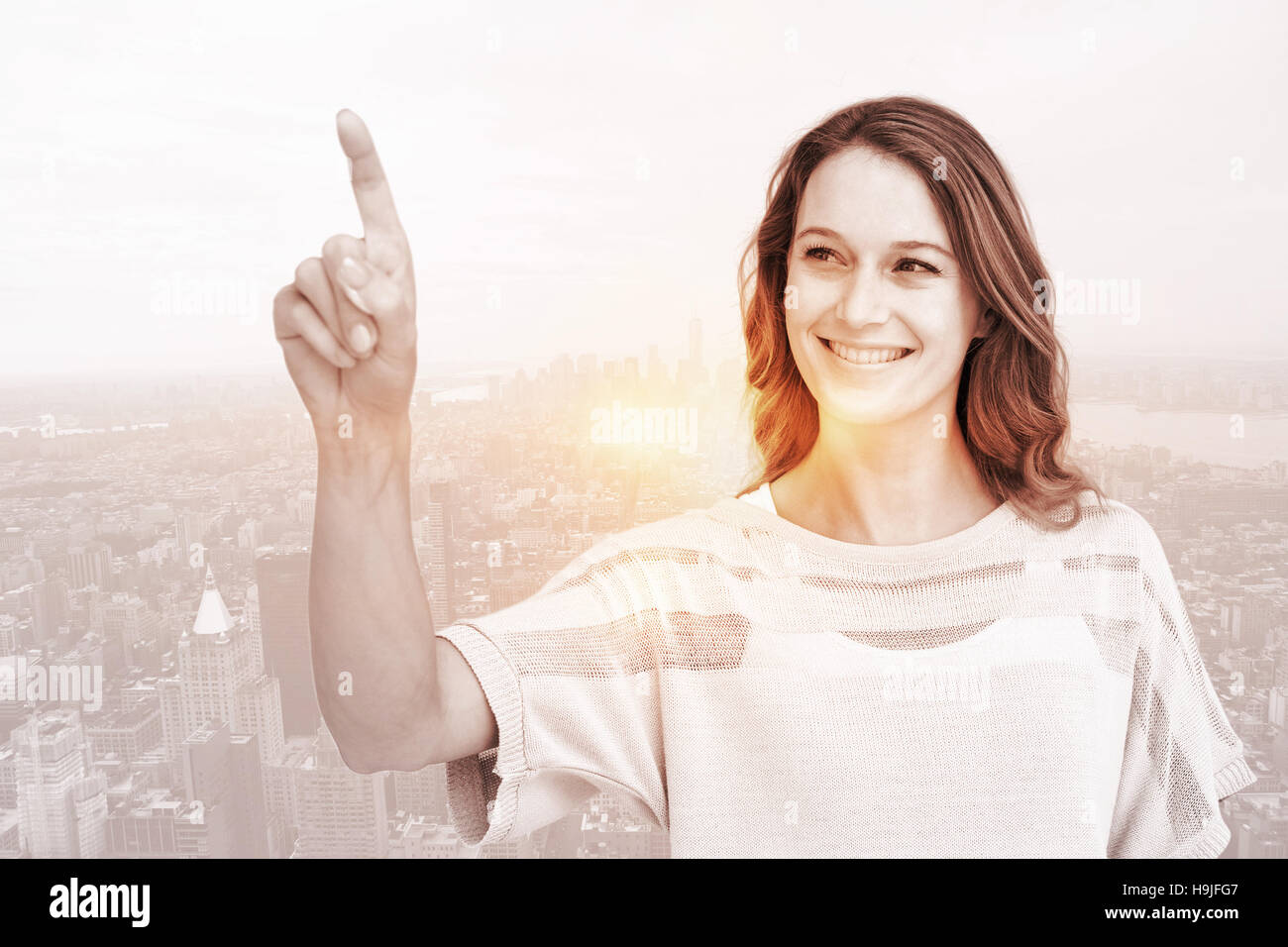 Image composite de jolie femme pointant avec son doigt Banque D'Images