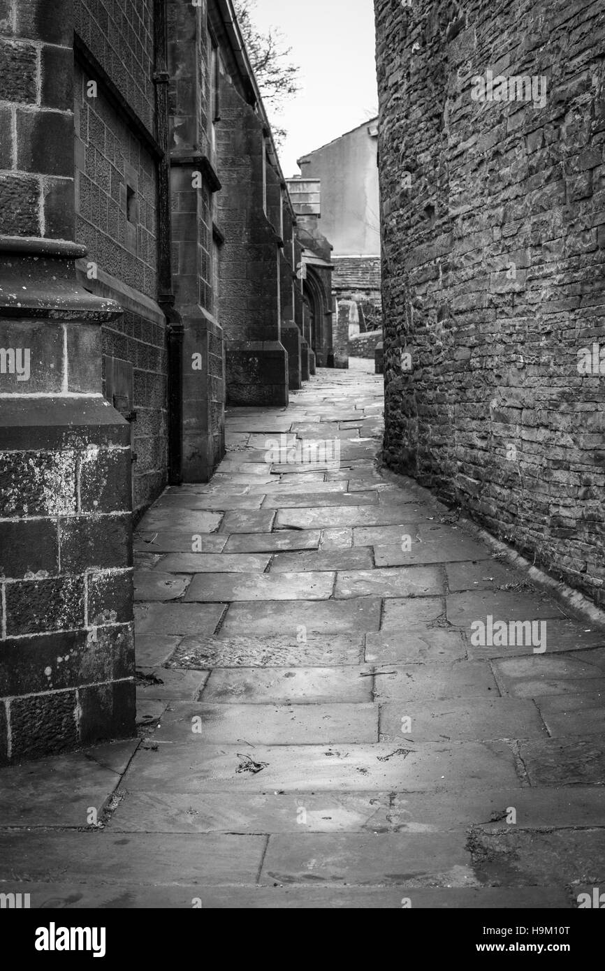 Un passage sur le côté de l'Église, West Yorkshire Haworth Banque D'Images