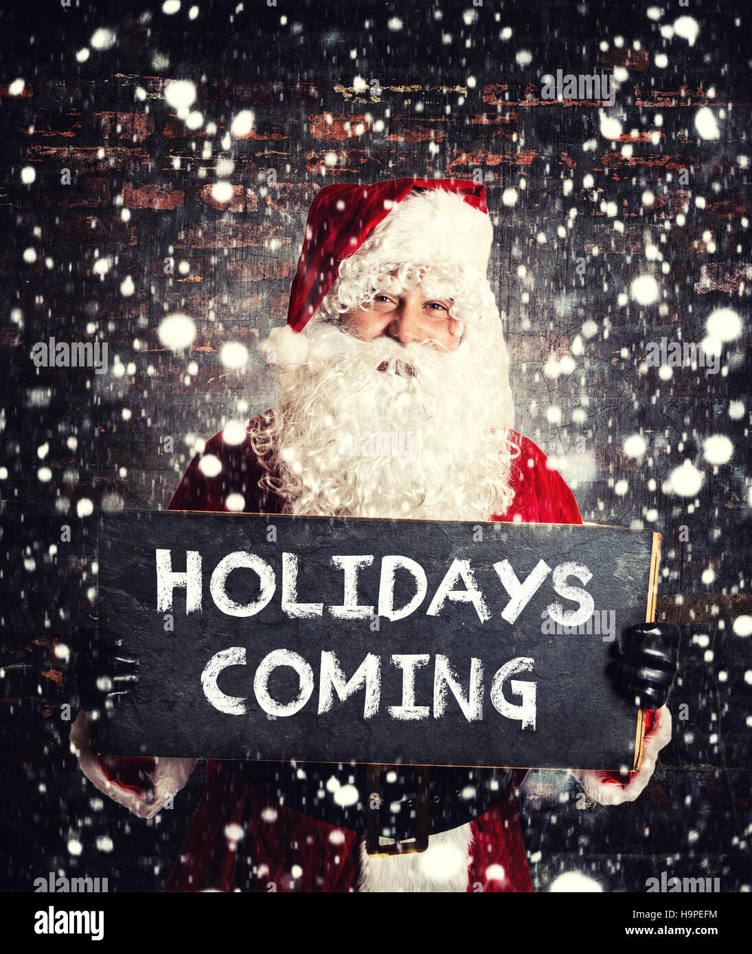 Le Père Noël avec les vacances prochaines sign on chalkboard Banque D'Images