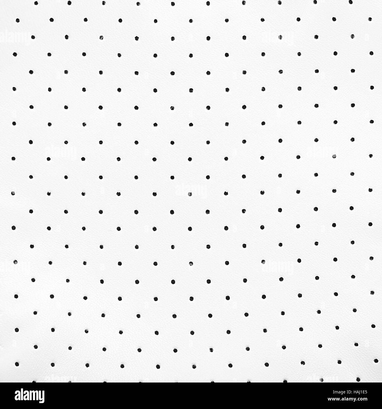 La texture en cuir blanc avec des petits trous noirs Banque D'Images