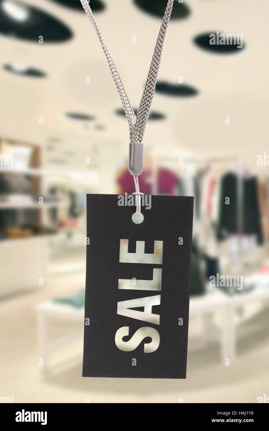 Vente sign in clothes shop Banque D'Images