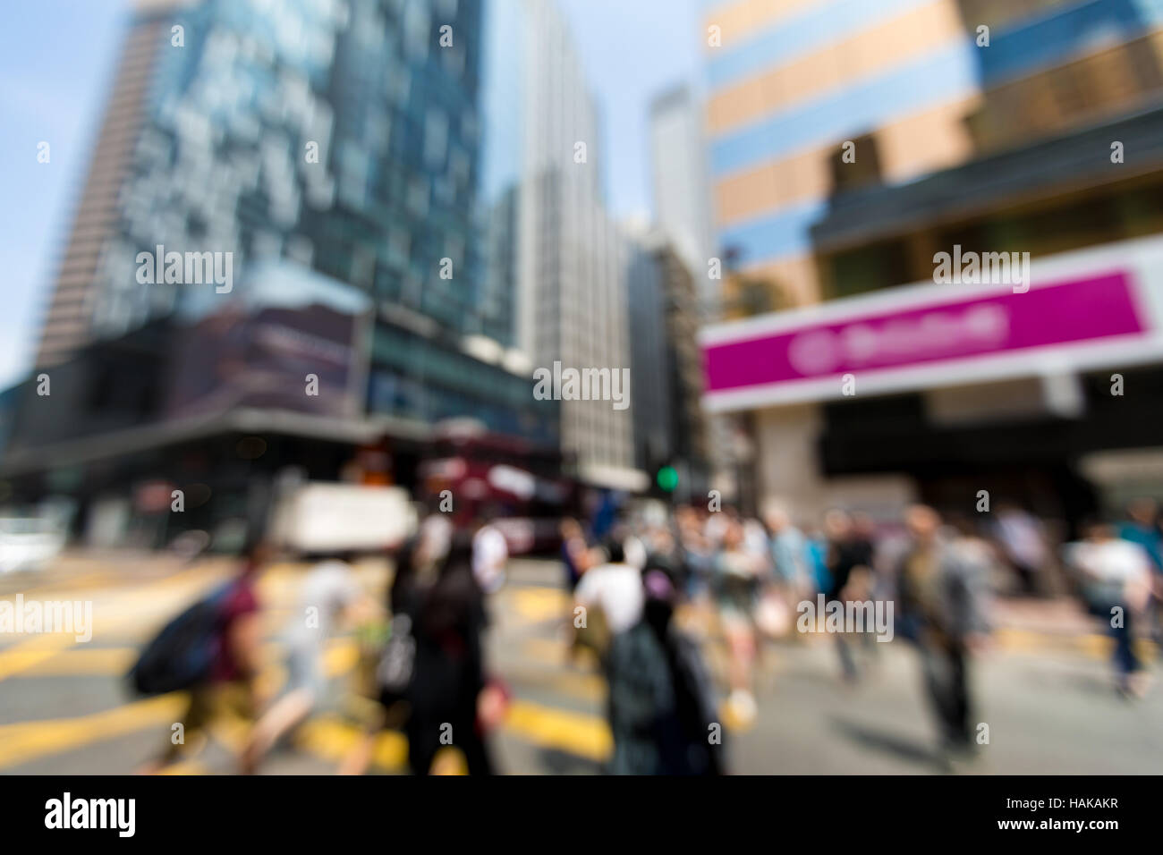 Les piétons floue dans quartier central des affaires de Hong Kong - Defocused Banque D'Images