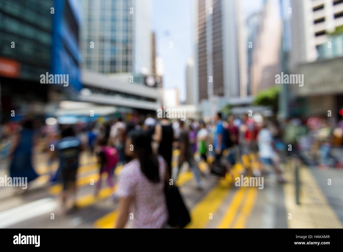 Les piétons floue dans quartier central des affaires de Hong Kong - Defocused Banque D'Images