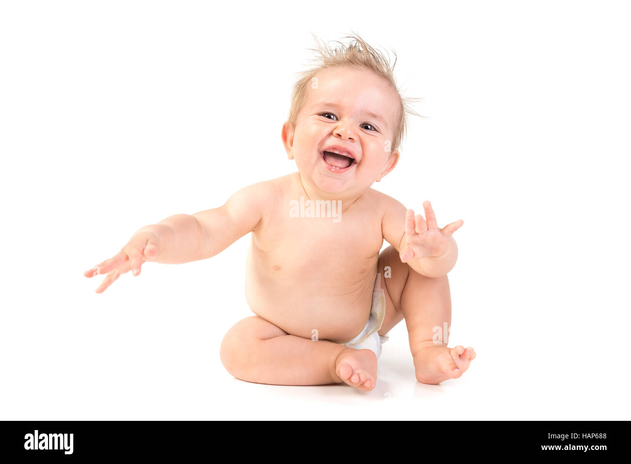 Magnifique petit garçon posant isolé en fond blanc Banque D'Images