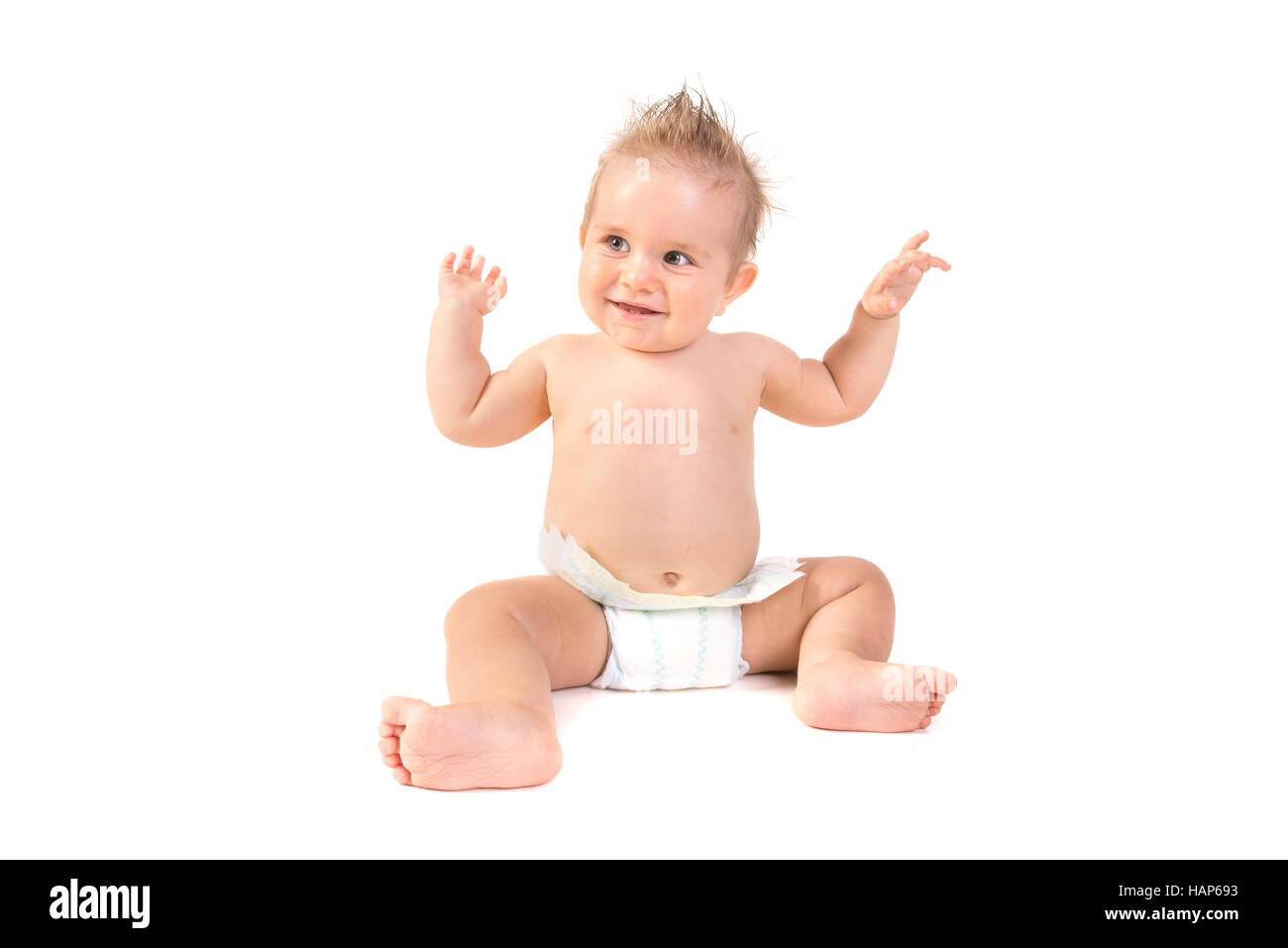 Magnifique petit garçon posant isolé en fond blanc Banque D'Images