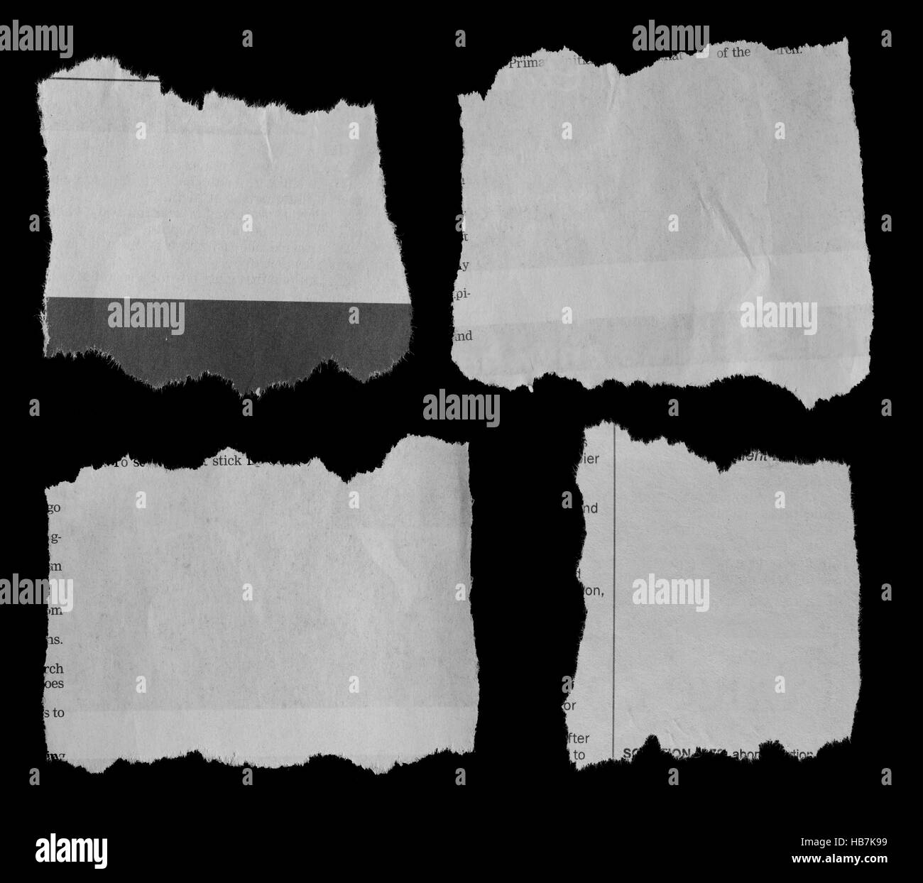 Morceaux de papier déchiré sur noir Banque D'Images