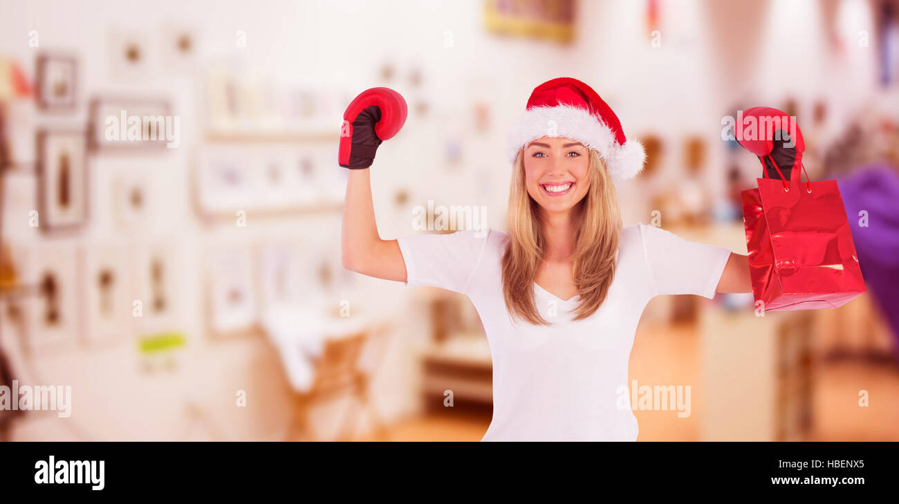 Image composite de blonde de fête avec des gants de boxe boxe Banque D'Images