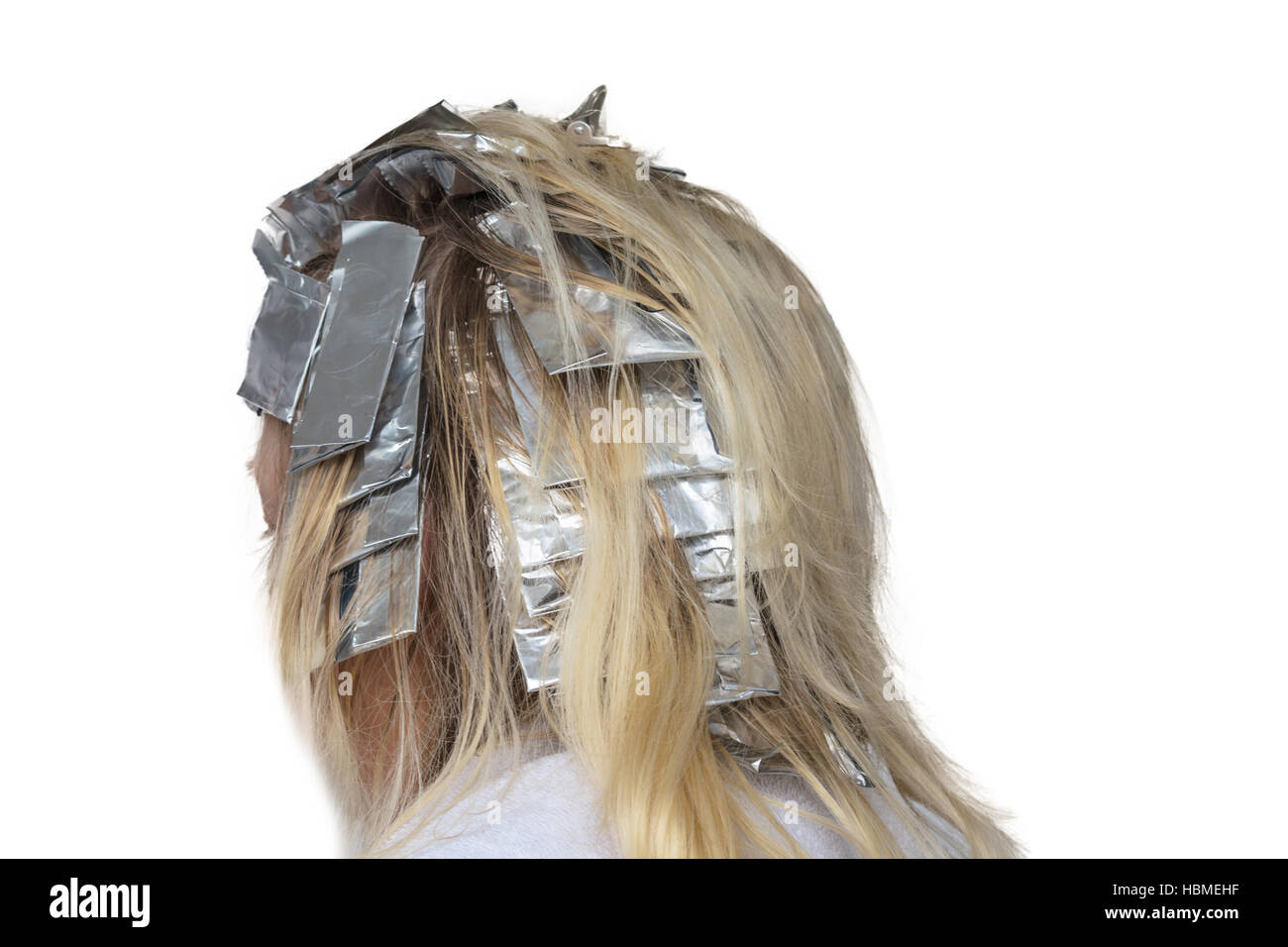 Faits saillants Les cheveux enveloppés dans du papier aluminium. Banque D'Images