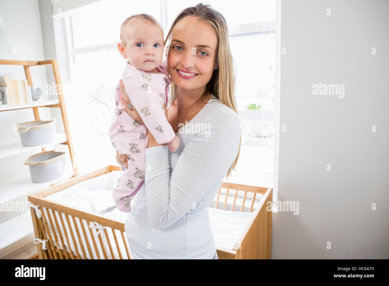 Portrait of mother holding her baby boy Banque D'Images