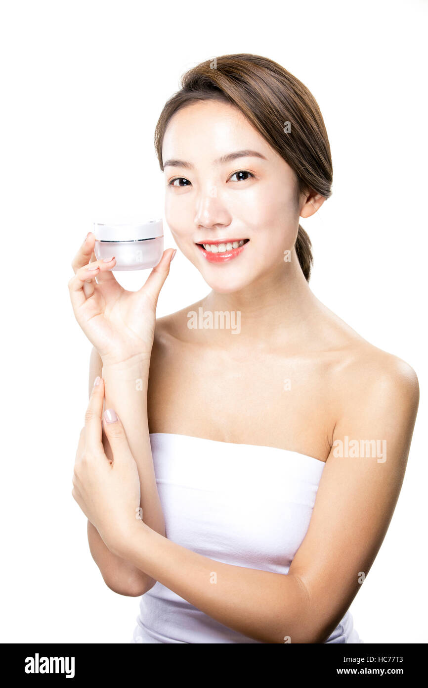 Smiling woman with cosmetic Banque D'Images