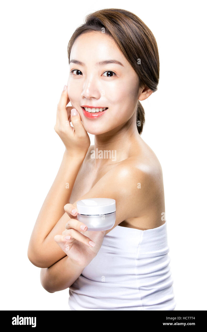 Smiling woman with cosmetic Banque D'Images