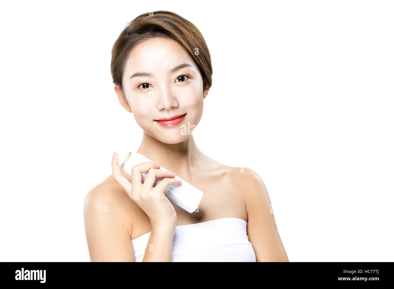 Smiling woman with cosmetic Banque D'Images