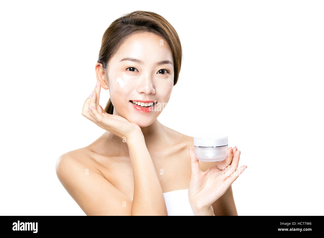 Smiling woman with cosmetic Banque D'Images