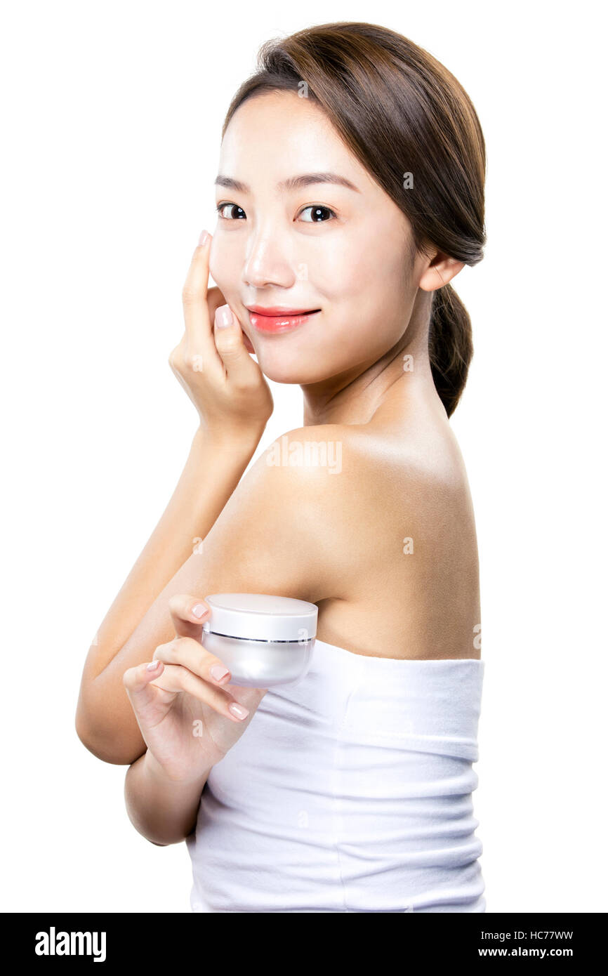 Smiling woman with cosmetic Banque D'Images