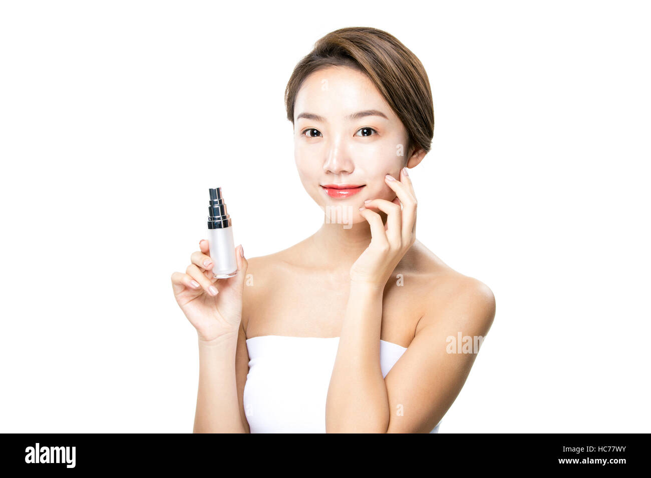 Smiling woman with cosmetic Banque D'Images