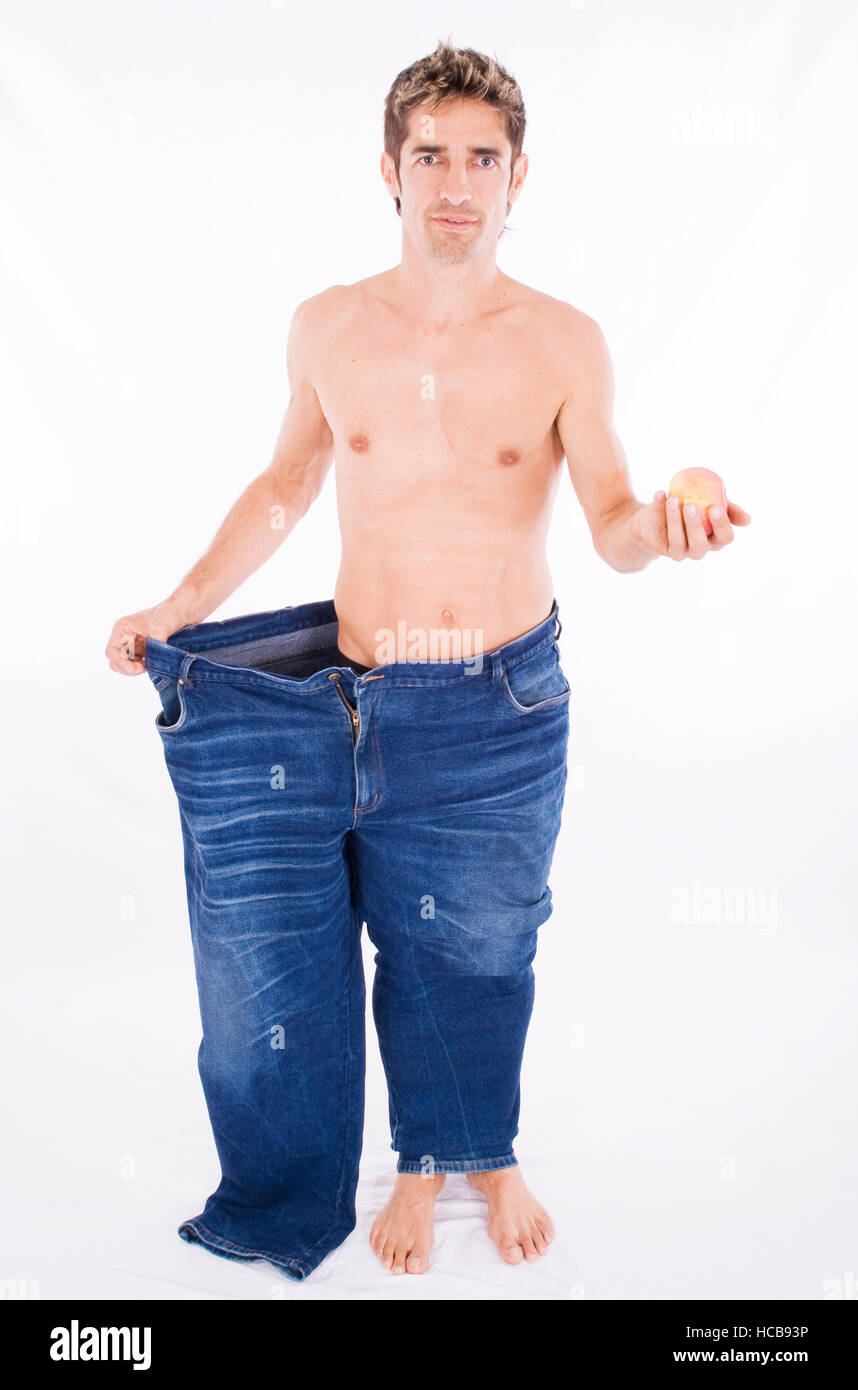 L'homme en pantalon trop grands après un régime réussi Photo Stock - Alamy