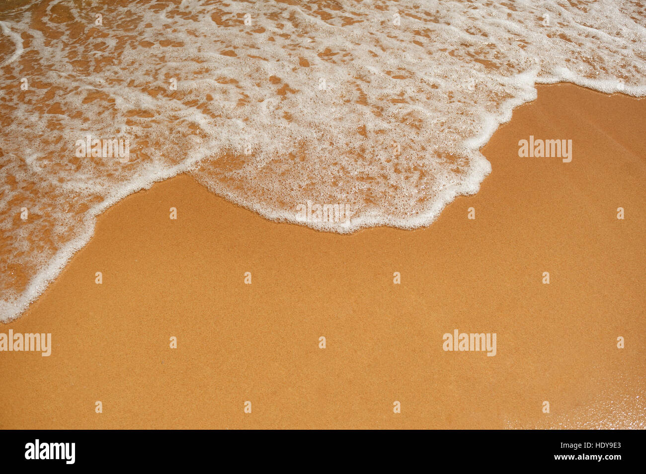 Plage de sable et mer vague texture Banque D'Images