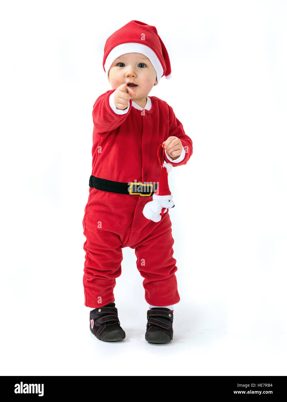 Portrait d'un enfant habillé comme le père Noël avec des jouets mous Banque D'Images