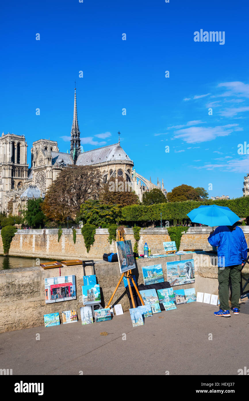 Artiste de rue avec des peintures près de la Cathédrale Notre Dame, Paris, France Banque D'Images