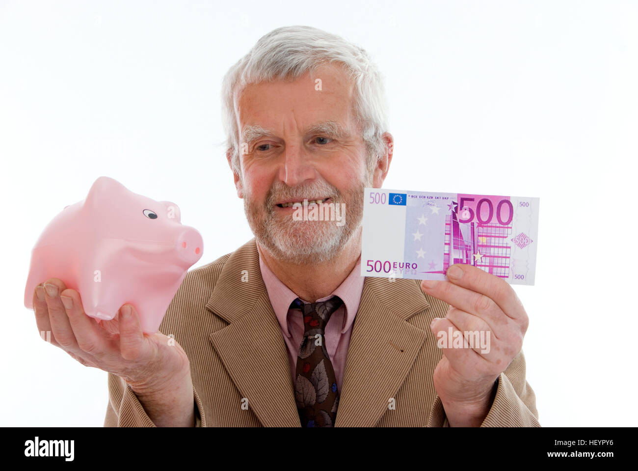 Man holding Piggy Bank et de l'euro fiduciaire Banque D'Images
