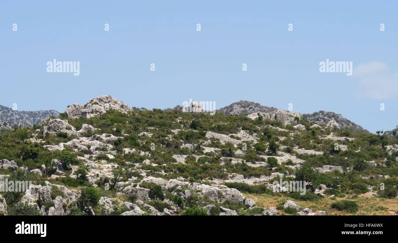 Lykian Rock Tombs dans les ruines de la Cité Engloutie Simena près de l'île de Kekova, Turquie Banque D'Images