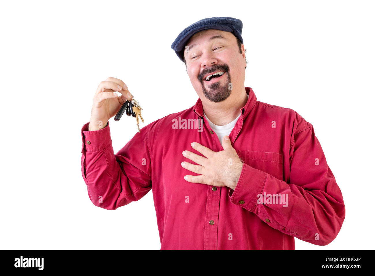 Homme d'âge moyen heureux propriétaire de voiture holding keys on white Banque D'Images