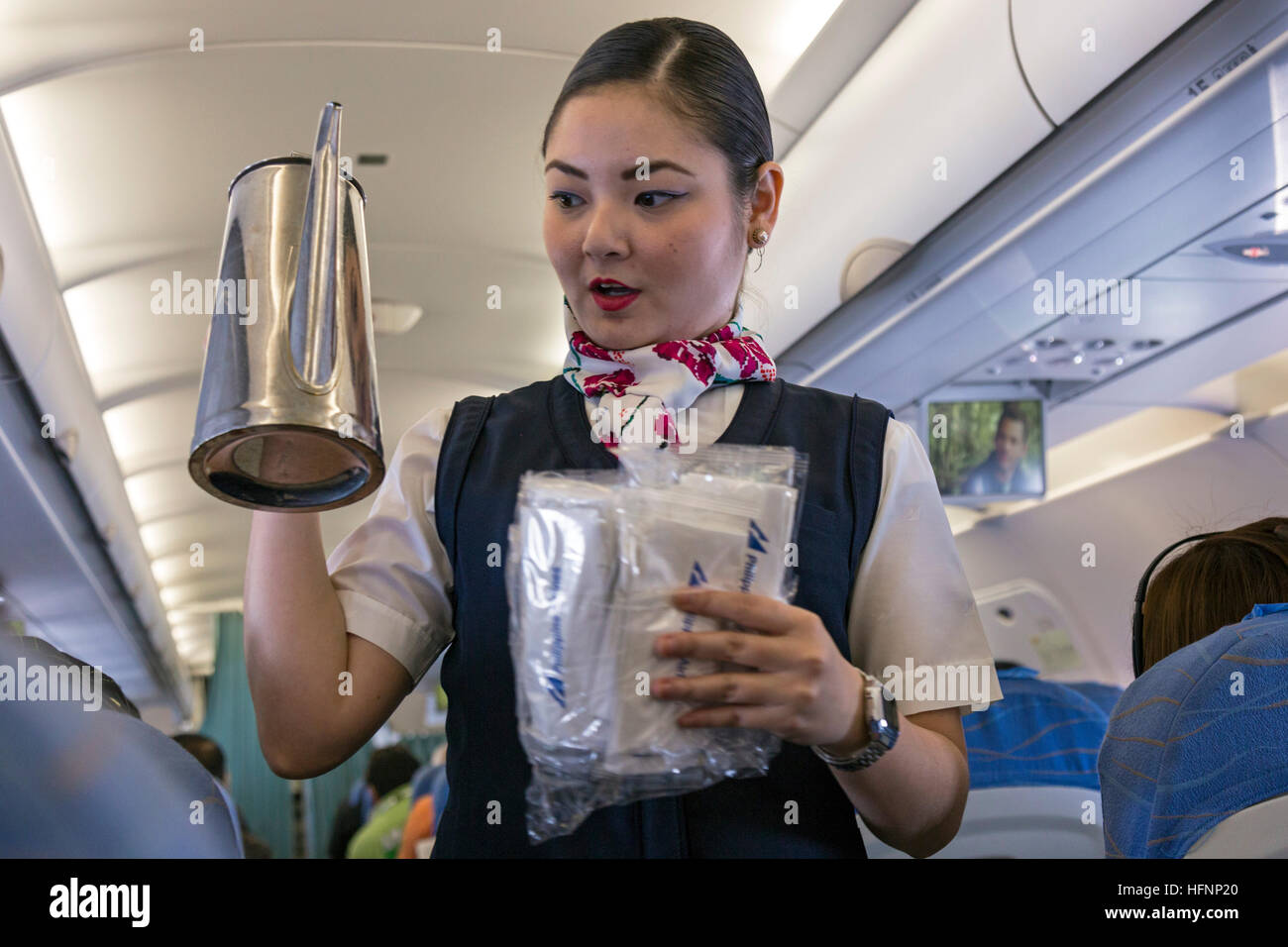 Les passagers et l'équipage de cabine sur Philippine Airlines vol de Manille Banque D'Images