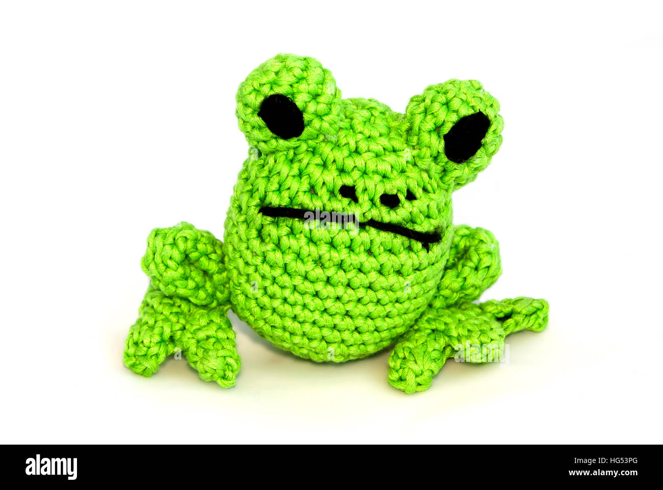 Jouets tricotés grenouille sur un fond blanc Banque D'Images