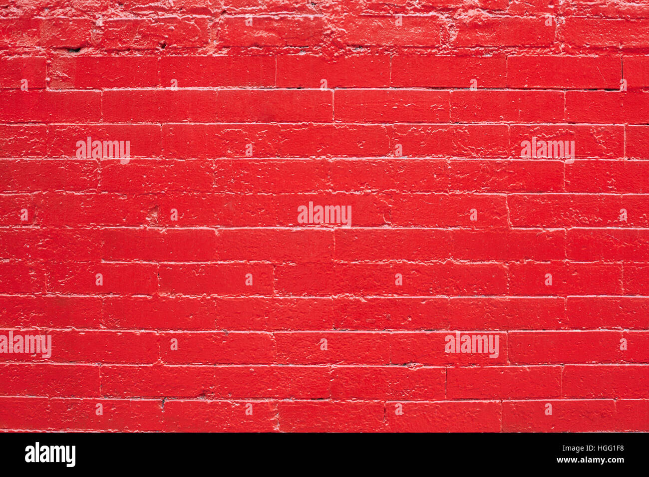 Mur de briques peint rouge texture background Banque D'Images
