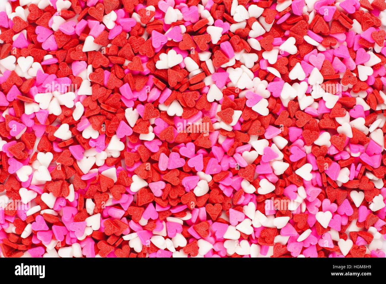 Valentines Day candy coeur fond sprinkles Banque D'Images