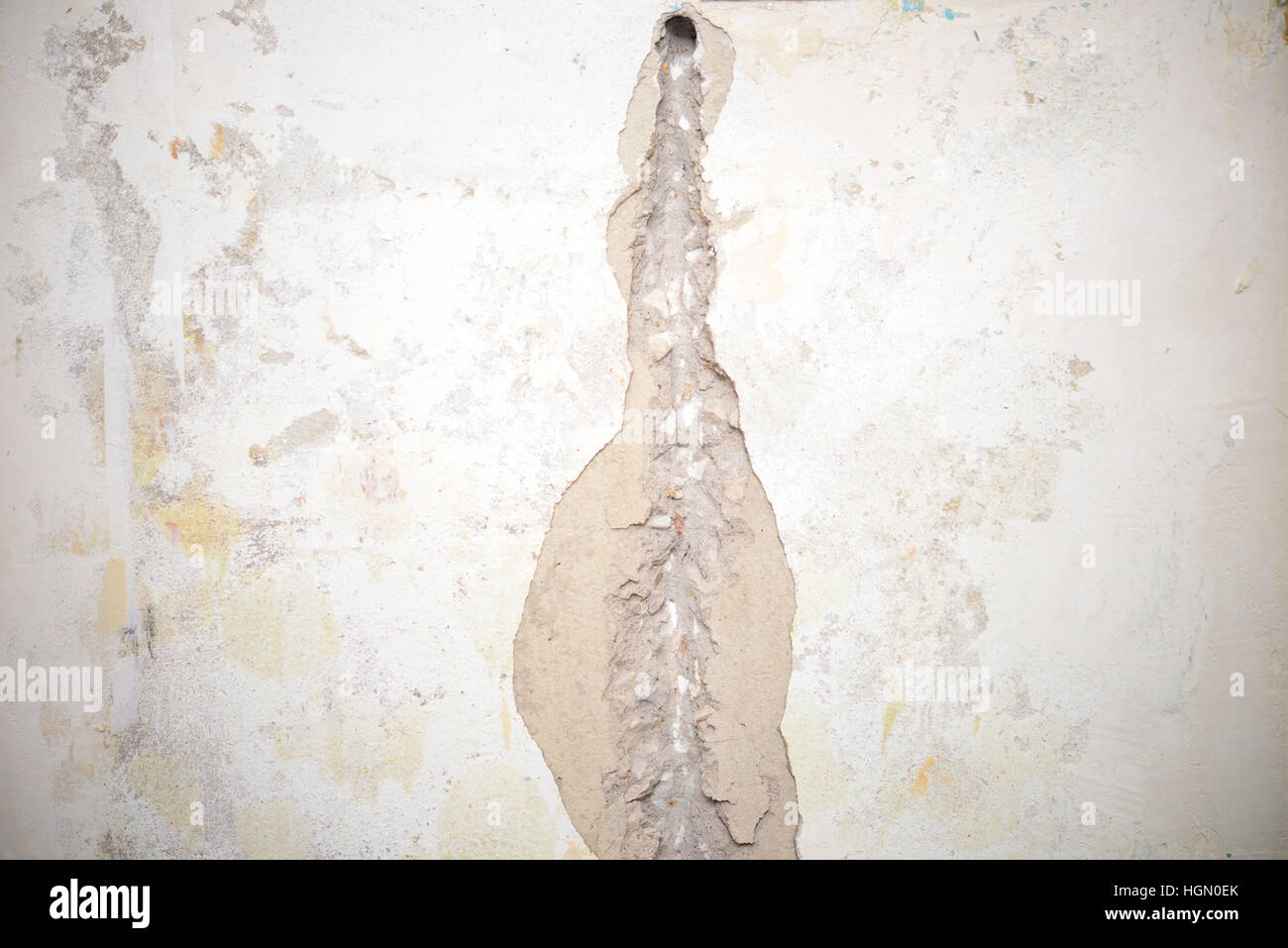 Trou dans la région de mur comme un arrière-plan Banque D'Images