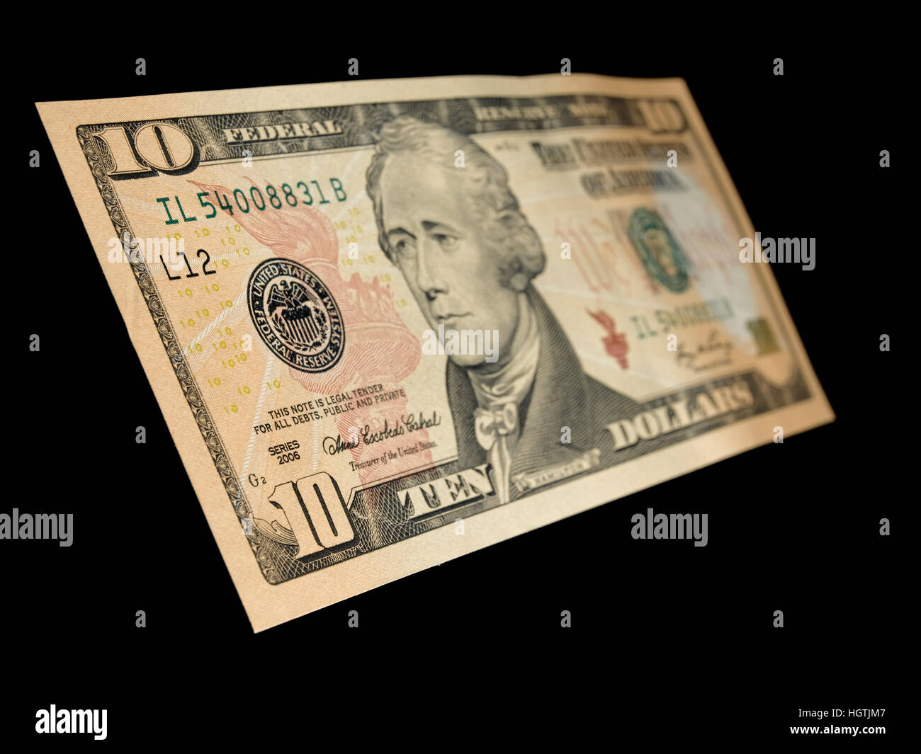 Dix dollars sur un fond noir Banque D'Images