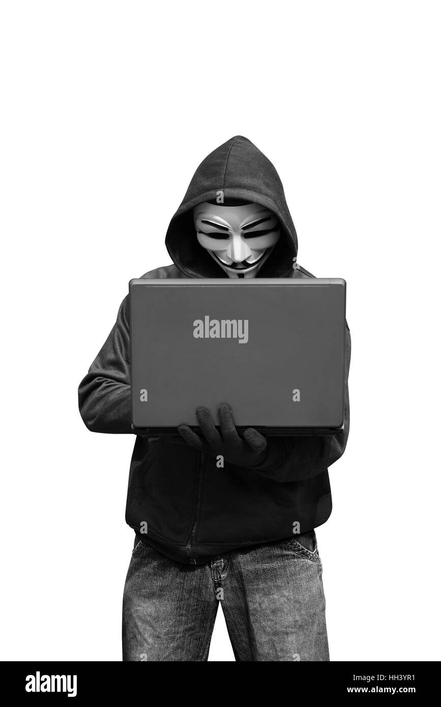 Hacker avec masque holding laptop tout en tapant isolated over white background Banque D'Images