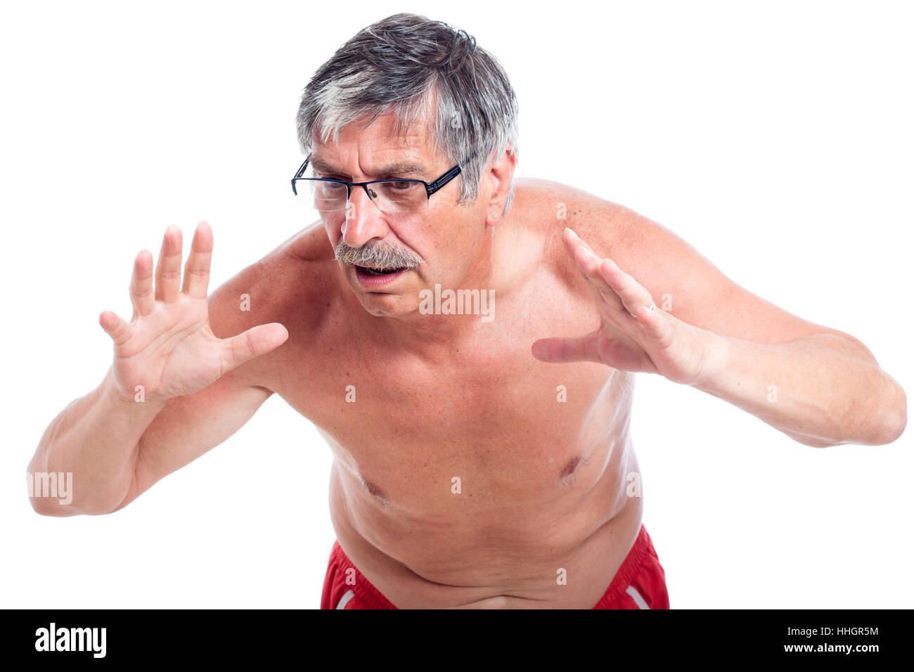 Surpris shirtless man gesturing, isolé sur fond blanc. Banque D'Images