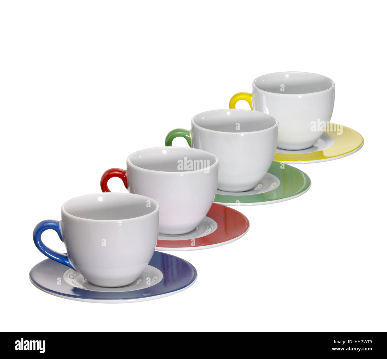 4 tasses et soucoupes en porcelaine dans une rangée, isolated on white with clipping path Banque D'Images