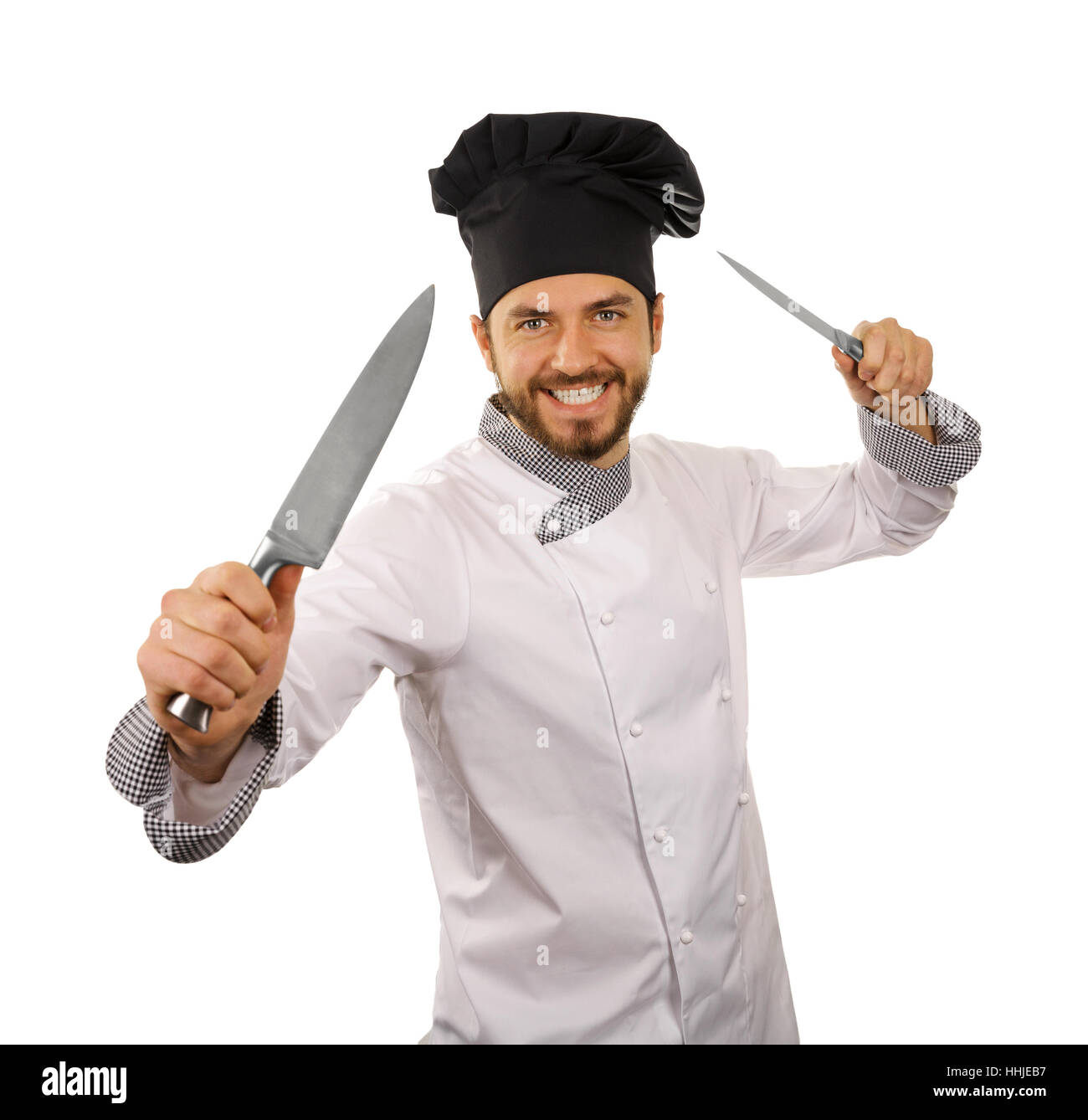 Chef cuisinier avec couteaux en mains isolé sur fond blanc Banque D'Images