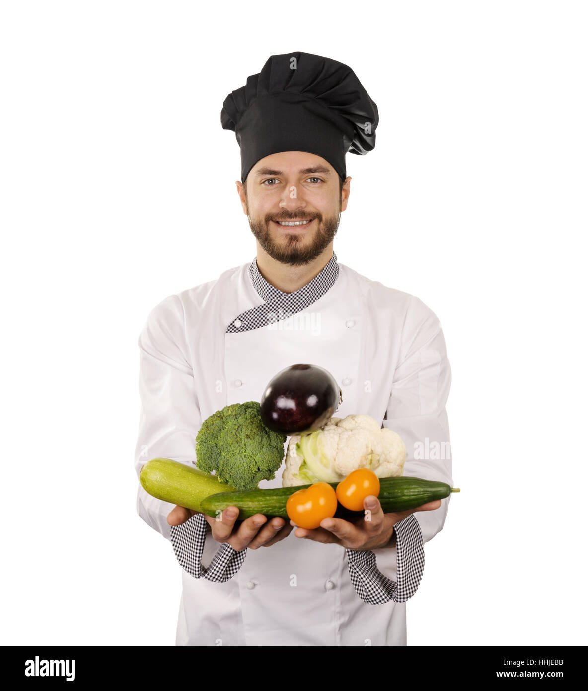 Smiling chef avec des légumes en mains isolated on white Banque D'Images