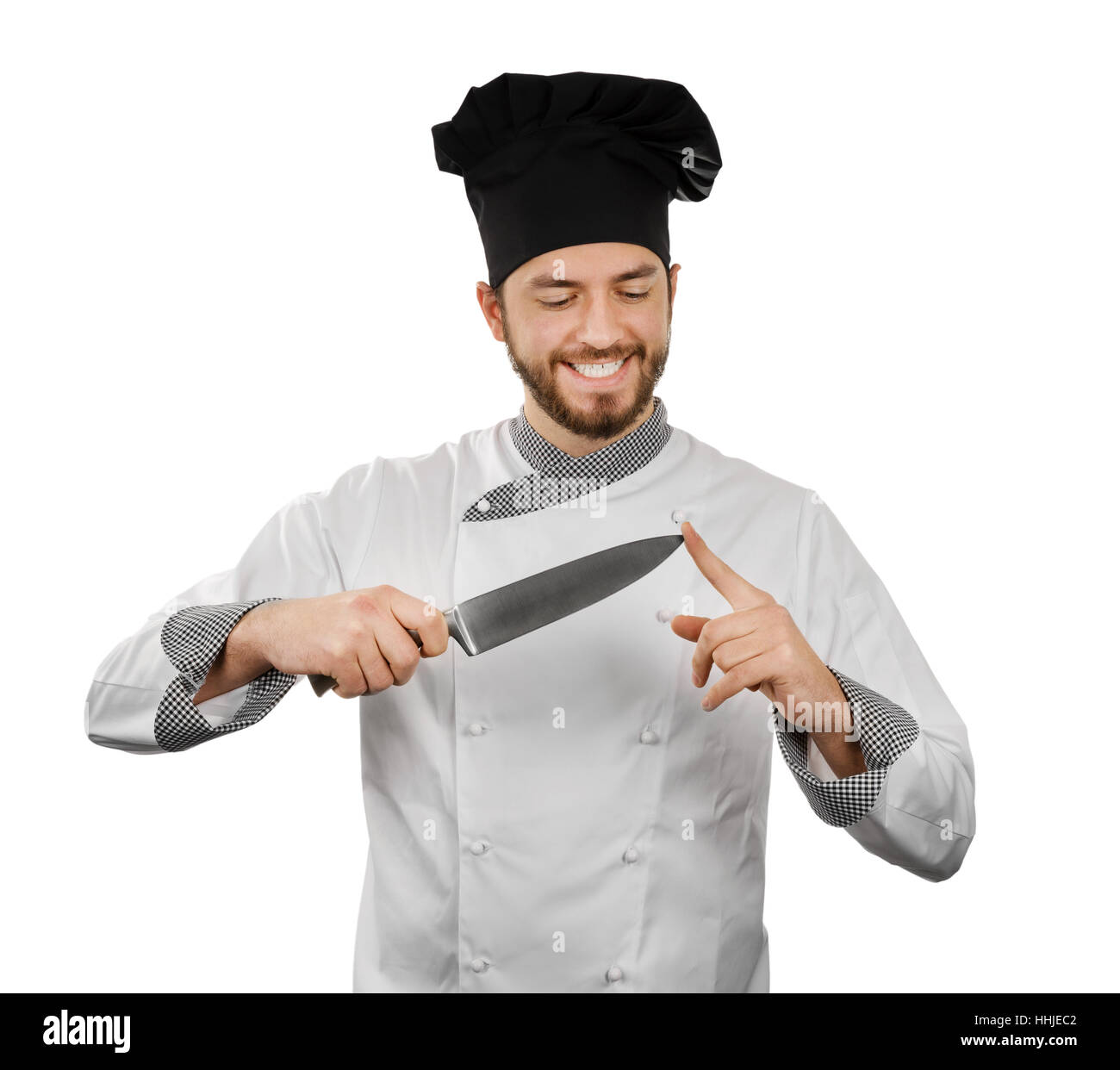 Le chef vérifie son couteau netteté. isolated on white Banque D'Images